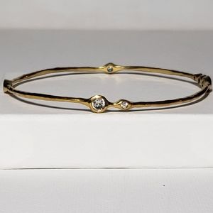 Gold plated bezel cubic zirconia station bangle